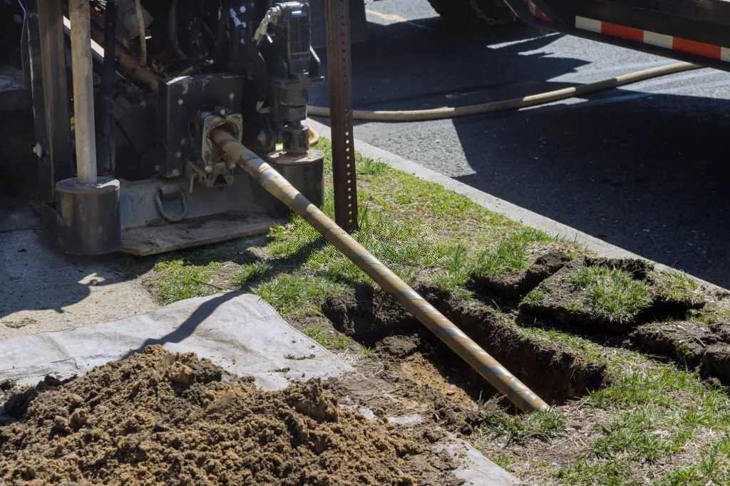 Expert plumber fixing sewer line